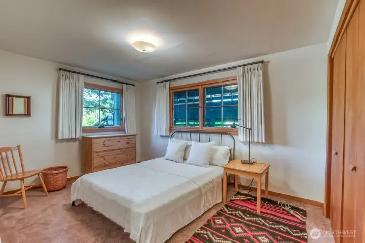 Downstairs bedroom has adjacent living areas.