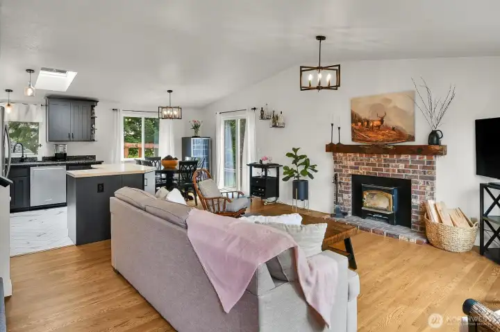 Bright, open-concept living space seamlessly connecting the kitchen, dining, and living areas, ideal for everyday living and entertaining.