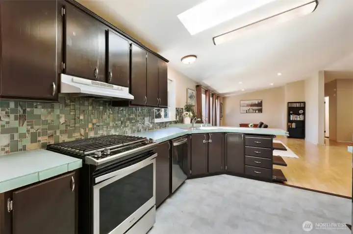 Modern kitchen with SS appliances, tons of cabinets & counter space.