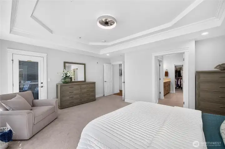 Spacious primary suite with elegant architectural details and seamless access to the ensuite bathroom.