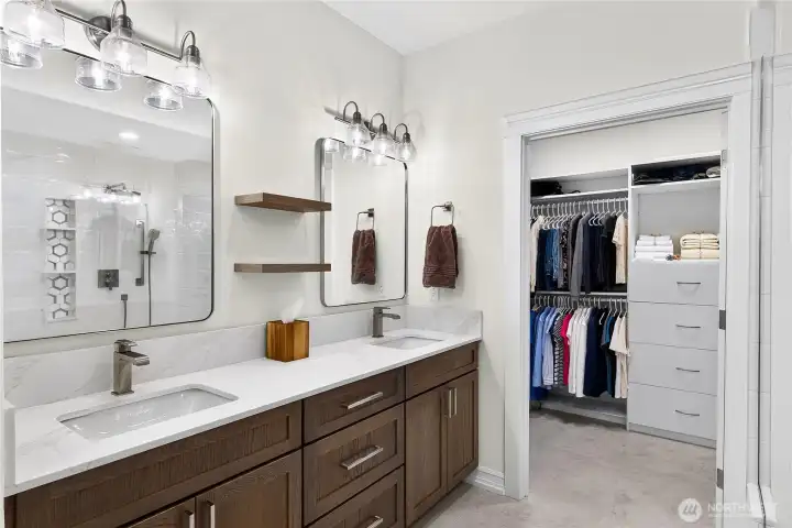 Remodeled primary bathroom with quartz countertops, updated vanity, and thoughtful aging-in-place design.