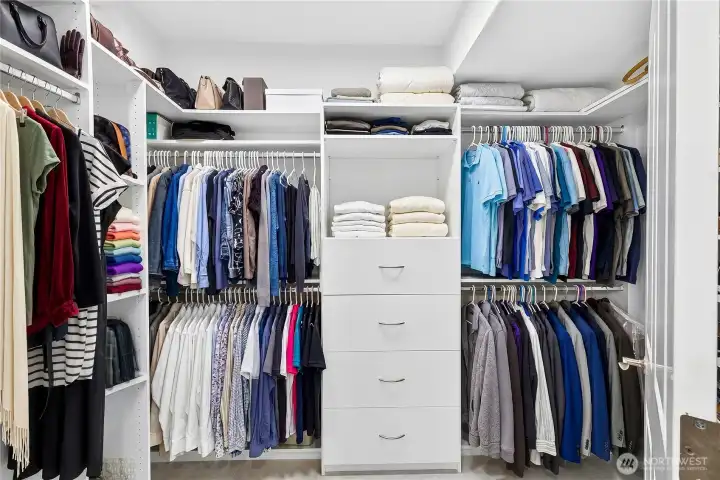 Custom California Closet system providing exceptional organization and storage within the primary suite.
