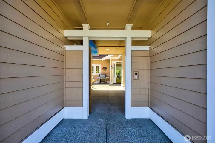 Private courtyard entrance creating a welcoming transition from the outdoors to this beautifully updated Anacortes condominium.