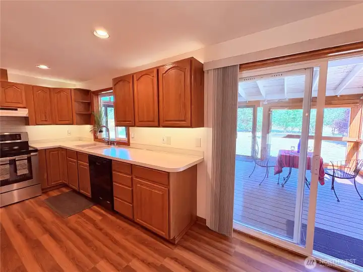 Kitchen with Sliding Door to Large glassed in Patio
