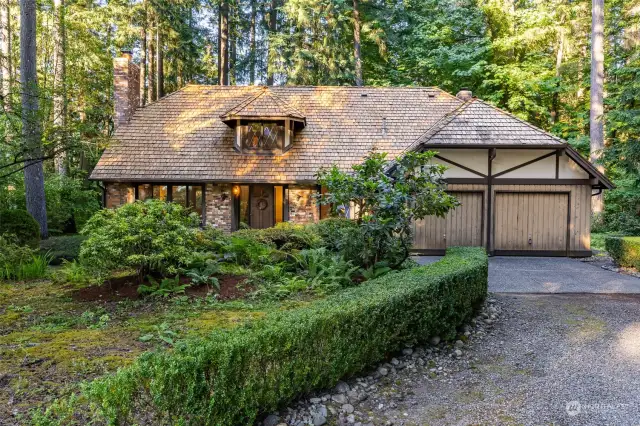 Welcome home! 2-story tudor in a private fairytale-like setting at end of a cul-de-sac.