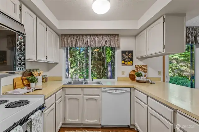 Spacious eat-in kitchen adjacent to dining room and family room with sliding door access to backyard.