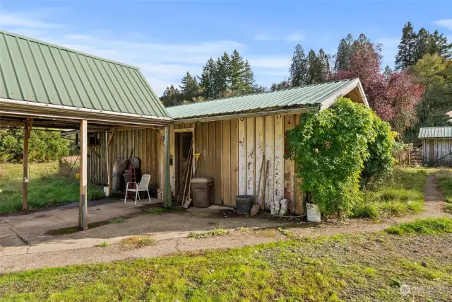 View of breezeway and entrance to workshop and meat locker/freezer.