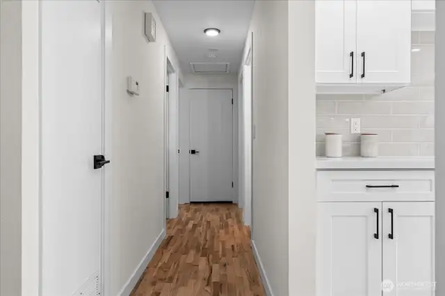 Gorgeous hardwood flooring sprawls from main living throughout hallway and bedrooms