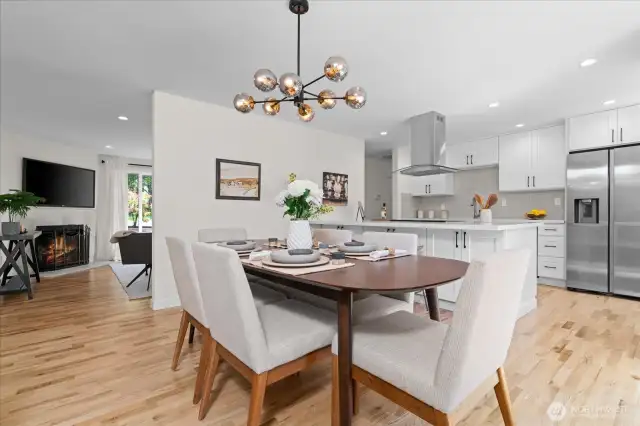 Gorgeous hardwood flooring runs throughout main living areas, creating cohesiveness