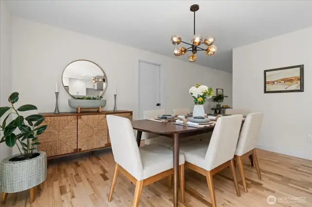 Elegant dining with modern chandelier and room for a hutch