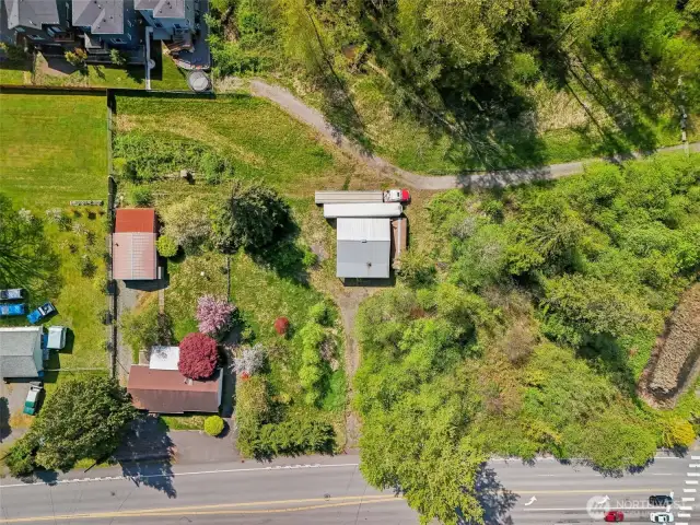 two outbuildings and a house on property