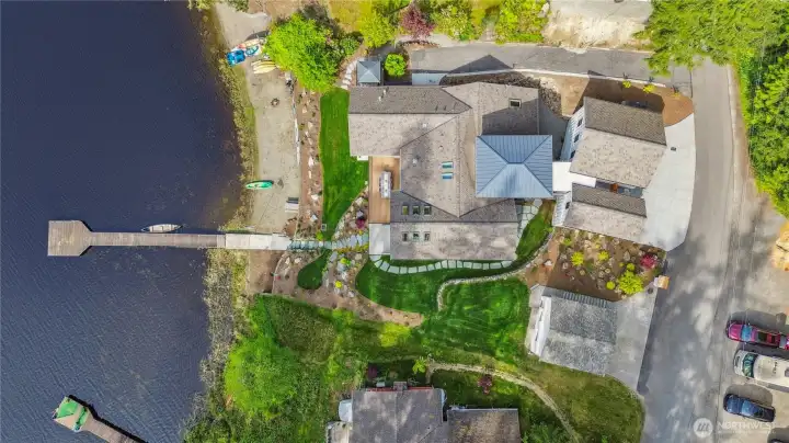 Aerial view of the shoreline and dock. Lake is stocked with trout and native bass.
