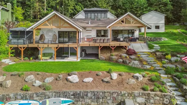 Elegance meets exclusivity in this remarkable waterfront retreat, tailored for those with a taste for the extraordinary. With 80 feet of private shoreline on one-third of an acre, this refined estate offers endless vistas of unspoiled beauty and a lifestyle defined by quiet sophistication.