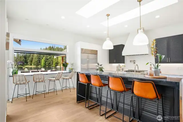 A chef’s kitchen with high-end appliances and a built-in espresso maker—you’ll never need to buy Starbucks again!
