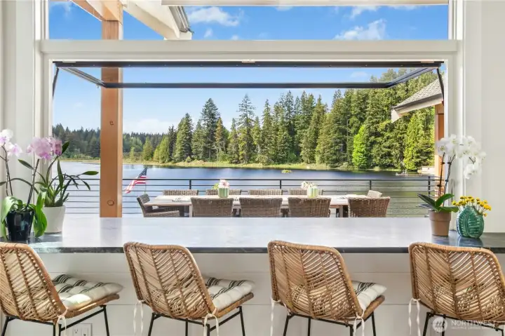 Interior seating in the kitchen at the pivot window with pass through