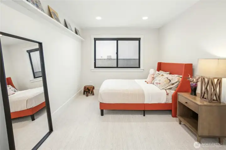 One of three additional main floor bedrooms.