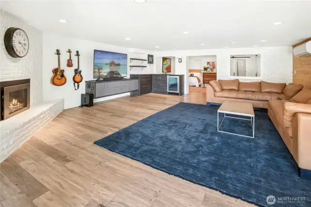 The expansive downstairs family room with sliding glass door to access backyard.