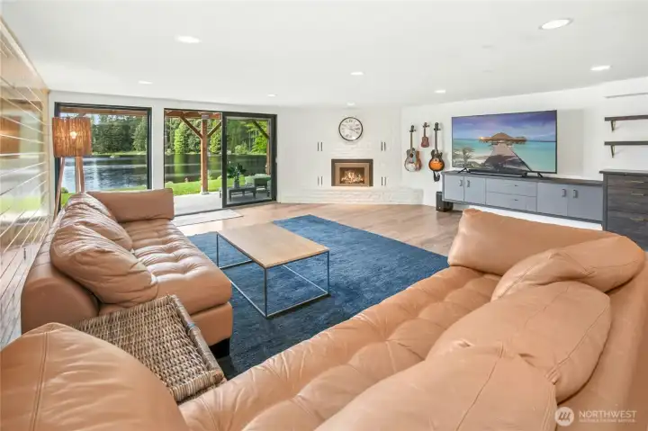 The expansive downstairs family room with sliding glass door to access backyard.