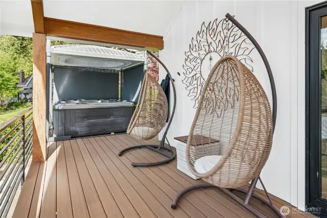 Relax in the hot tub with a motorized retractable cover and privacy blinds.