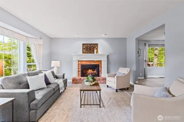 Living room with fireplace is to the left of entry