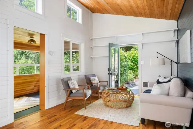 Cottage living room and entryway to enclosed porch