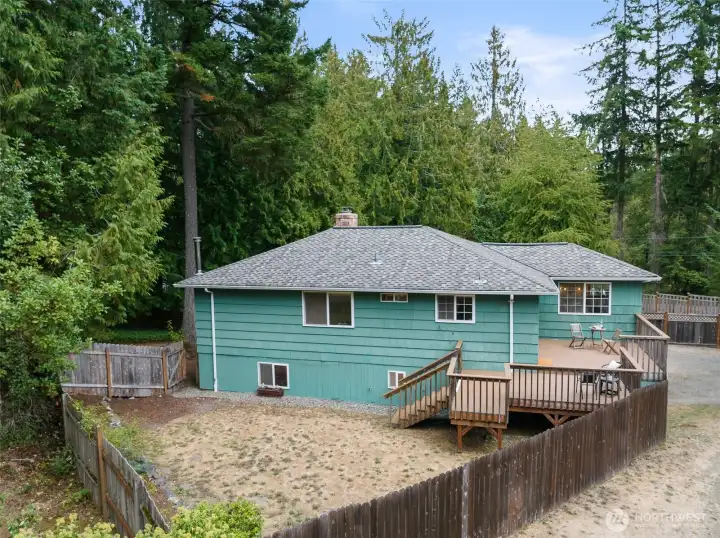Separately fenced backyard and private back deck—plenty of space to enjoy with guests or for a lower-level renter.