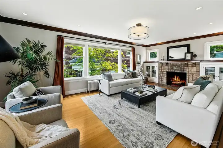 Upon entering you are greeted with a spacious living room running the along the east side of the home.