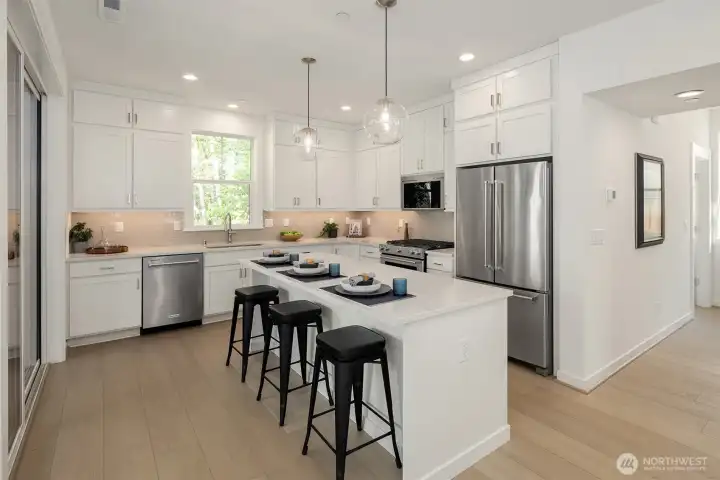 This cottage home does not lack for cabinets and storage. Gas range for those who love to cook.