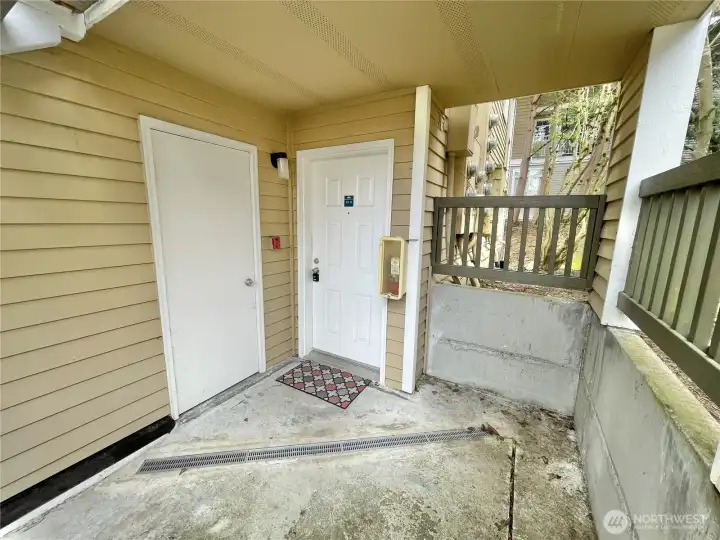 Covered front patio with storage closet
