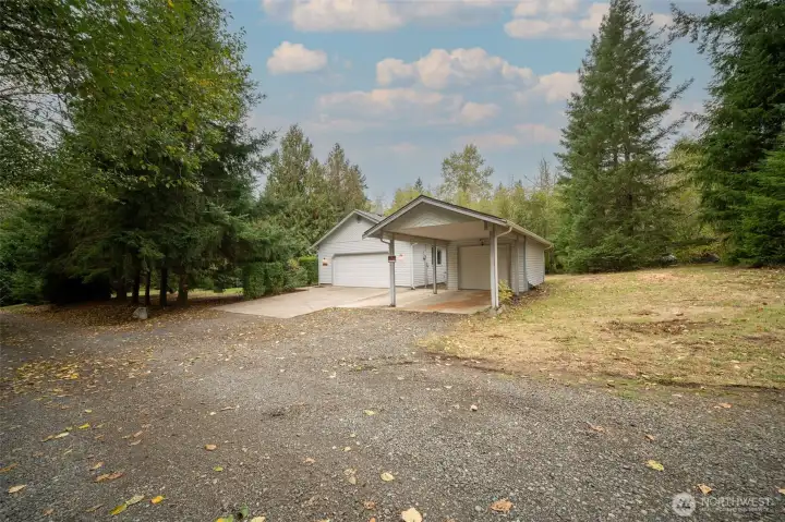 Ample parking with 2 car garage, detached pull-thru garage, as well as covered parking and driveway parking.