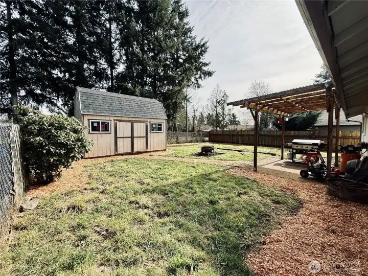 7703 NE 156th Ave, Vancouver, enjoy a large lot with outbuildings, fully fenced backyard, covered patio to enjoy quiet evenings while being minutes from everything East Orchards has to offer