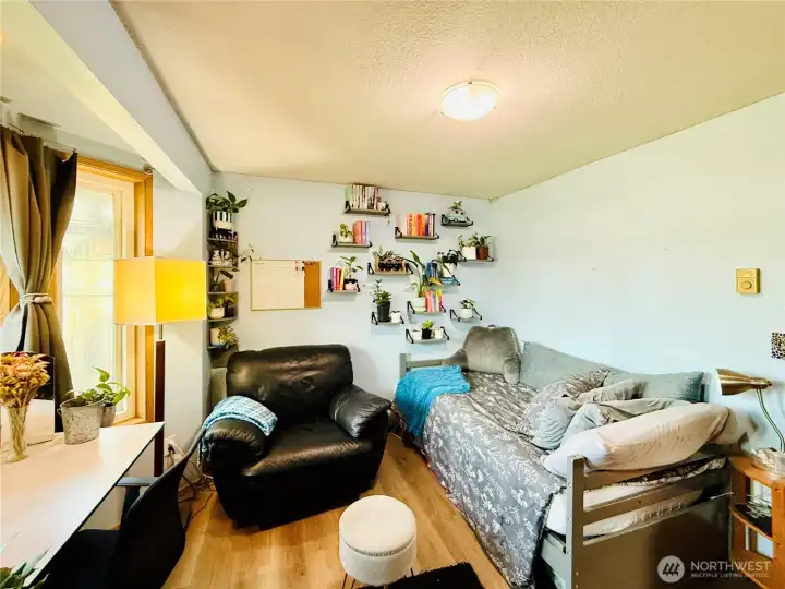 Front bedroom with bay windows, LVP flooring, full bathroom next door