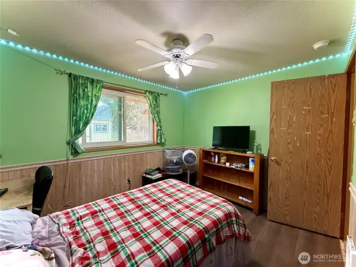 Back bedroom, Lvp flooring, bathroom next door, views to the fully fenced backyard