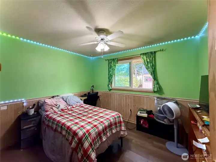 Back bedroom, Lvp flooring, bathroom next door, views to the fully fenced backyard