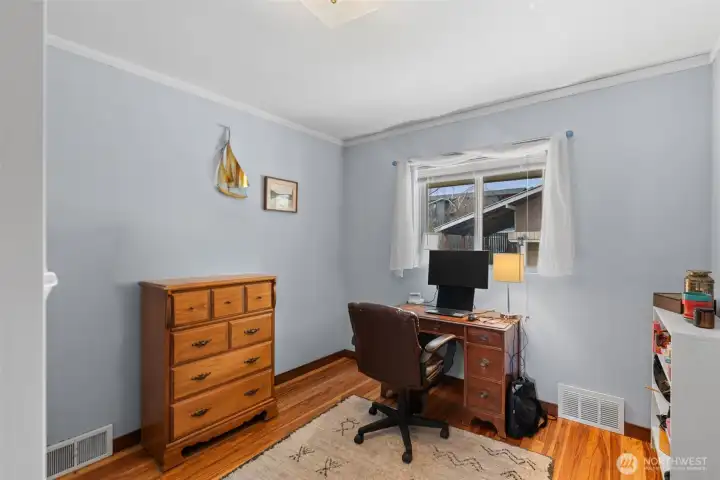 The third bedroom is currently being used as a home office giving a functional feel yet easily usable as a bedroom