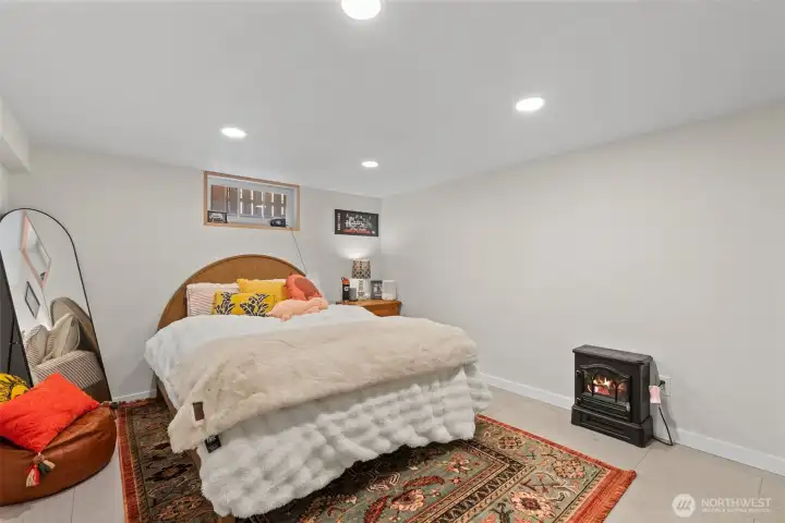 This downstairs space is currently hosing a queen size bed and still has plenty of room for just hanging out. Space use is endless...