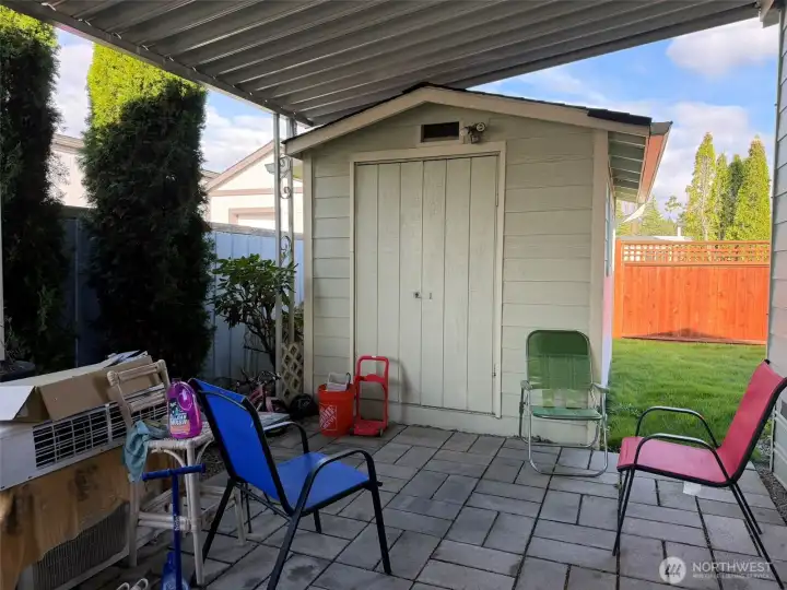 Carport with storage shed