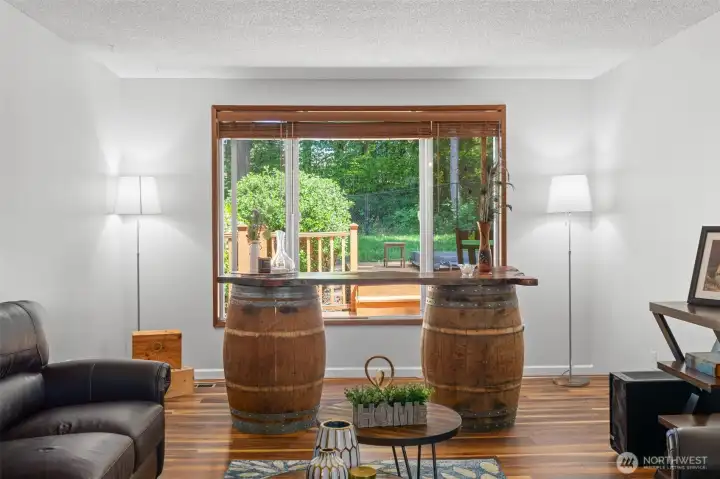 Large picture window fills the living space natural light and frames peaceful backyard. Freshly painted. Large picture window fills the living space natural light and frames peaceful backyard. Freshly painted.