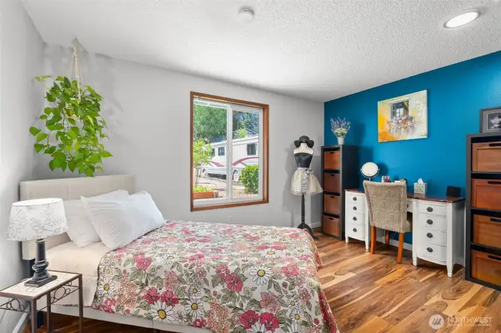 Bright and inviting secondary bedroom with updated flooring, fresh finishes and ample natural light. Bright and inviting secondary bedroom with updated flooring, fresh finishes and ample natural light.