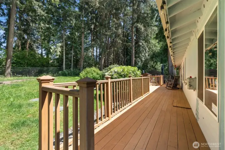 Expansive wrap-around deck overlooking the private fully fenced backyard. Expansive wrap-around deck overlooking the private fully fenced backyard.