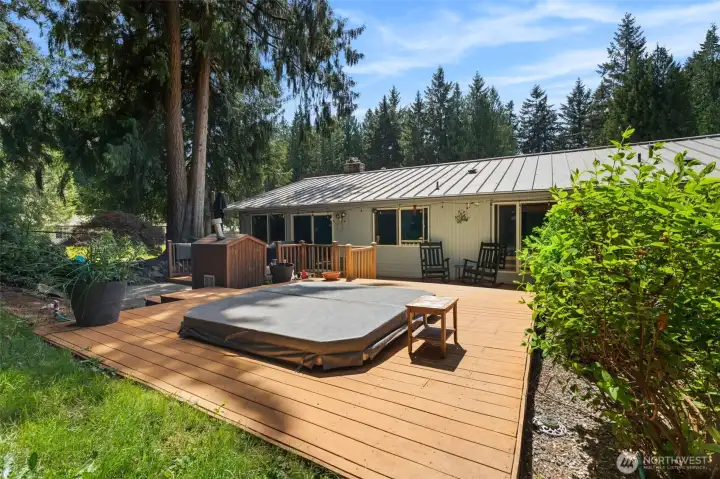 Expansive entertaining deck with hot tub. Expansive entertaining deck with hot tub.