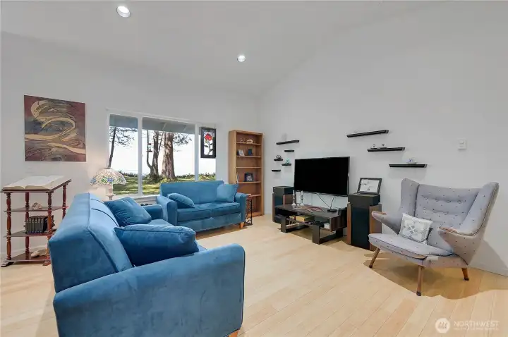 The space features recessed lighting and a comfortable atmosphere.