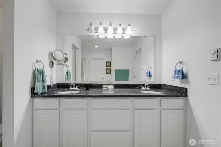 Double vanity and granite countertop.