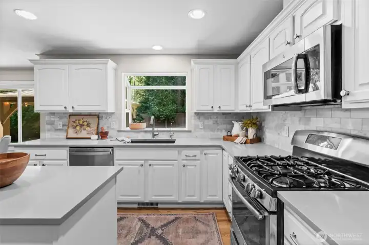 A gourmet kitchen featuring top-tier finishes, premium appliances, a large center island, and an open layout that flows effortlessly into the main living areas. A gourmet kitchen featuring top-tier finishes, premium appliances, a large center island, and an open layout that flows effortlessly into the main living areas.