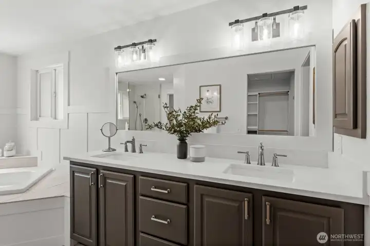 The luxury primary ensuite features a dual-sink vanity, custom tile shower, soaking tub, and premium architectural finishes. The luxury primary ensuite features a dual-sink vanity, custom tile shower, soaking tub, and premium architectural finishes.