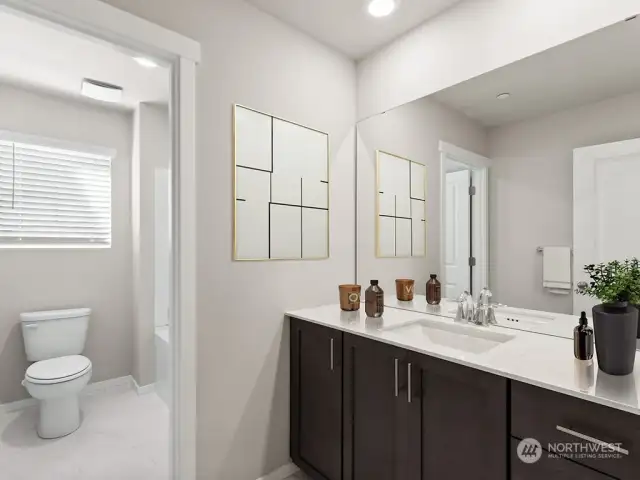 Upstairs full bath with door to separate shower and sink area.  . “Photos are for representational purposes only. Colors and options may vary”
