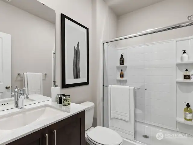 Main level 3/4 bath with large walk-in shower. . “Photos are for representational purposes only. Colors and options may vary”