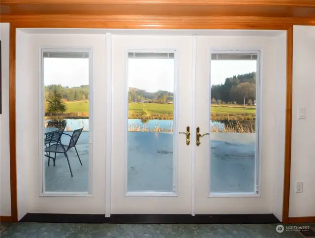 View out living room french door with patio