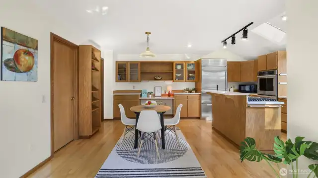 Bright and modern kitchen offers tons of cabinet and counter space with open sight lines throughout the main living space, great for entertaining.