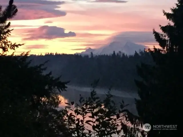 Seller photo showcasing the amazing sunsets and views of the lake and Mount Rainier from the home.